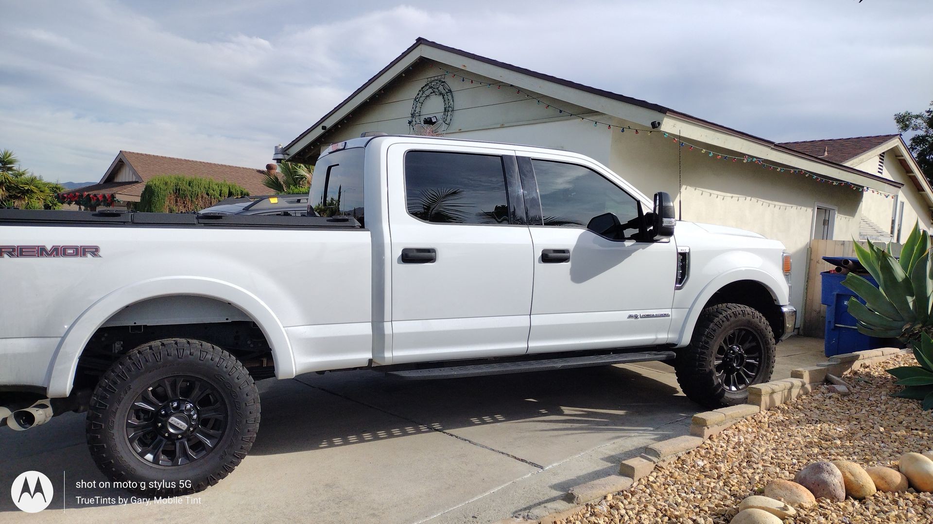 TrueTints by Gary, Mobile Automotive Window Tinting Service of San Diego County. On location at customers home tinting the window on Ford F-250.